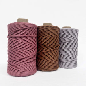 deep rope dark brown faded purple combination photo of cotton cord on white wall