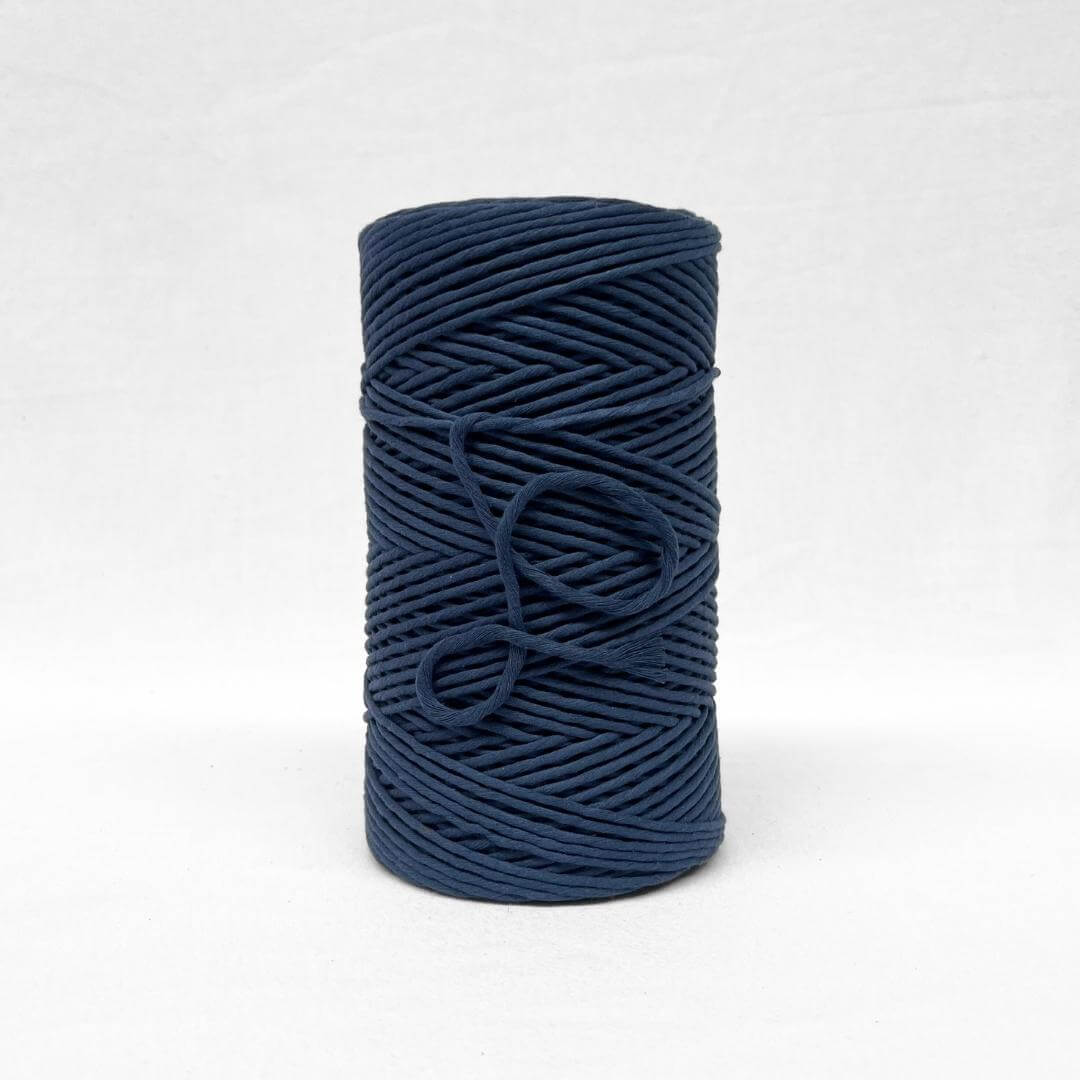 3mm navy blue cotton string standing alone on white back drop