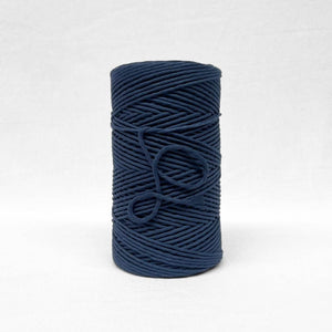 3mm navy blue cotton string standing alone on white back drop