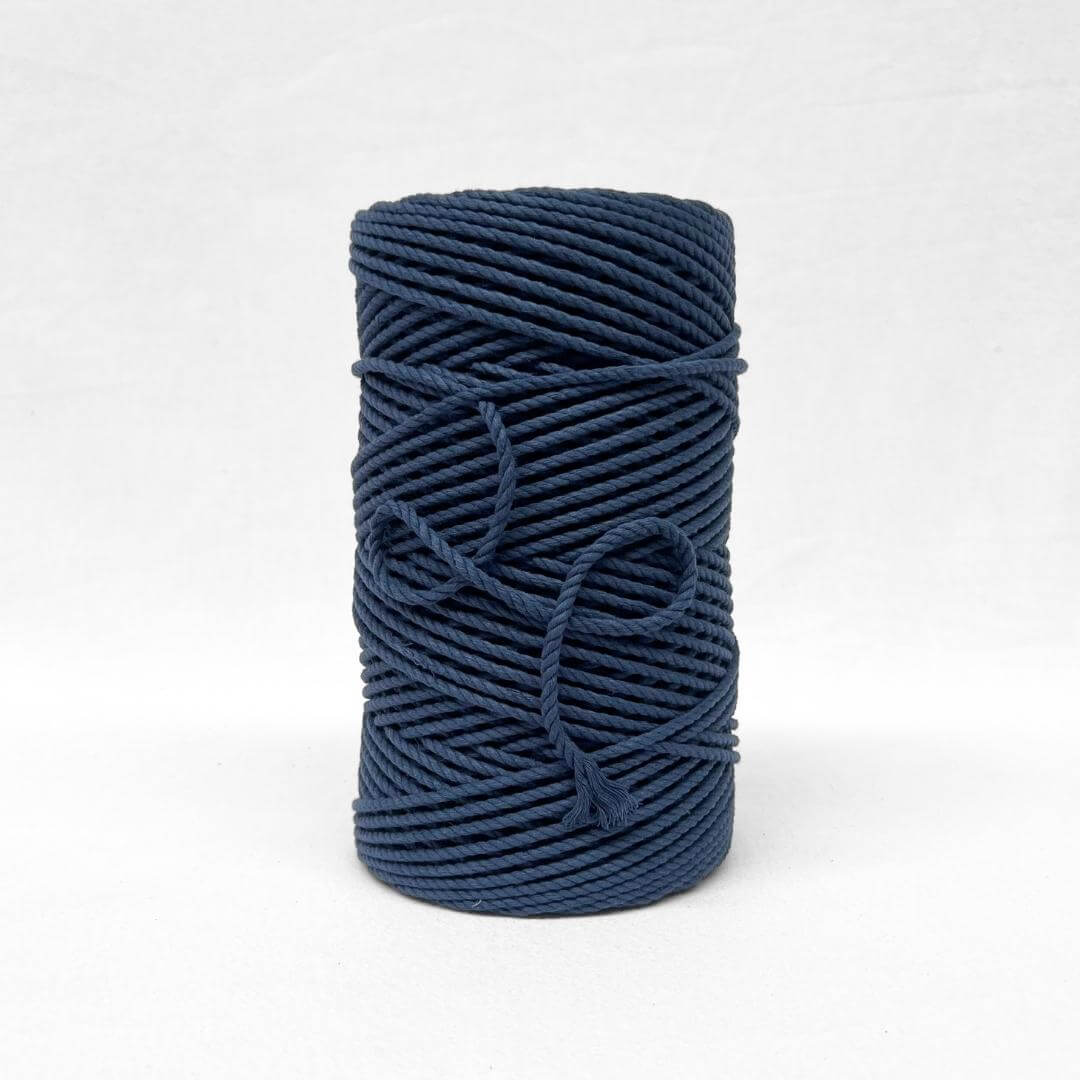 deep navy blue 4mm 3ply cotton macrame cord close up image of single roll standing with white background