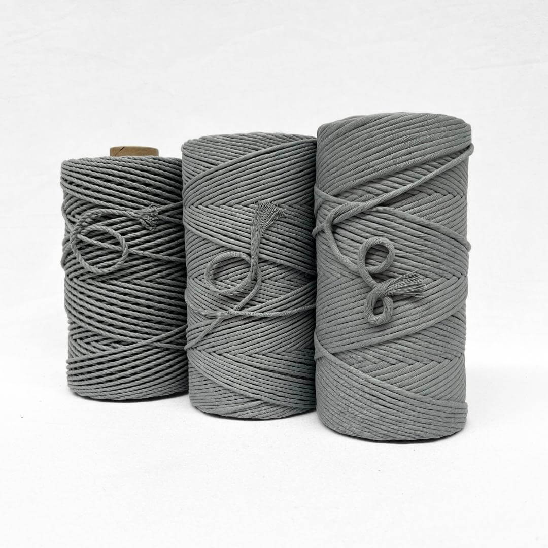 combination image showing three rolls of strom grey standing side by side on white background