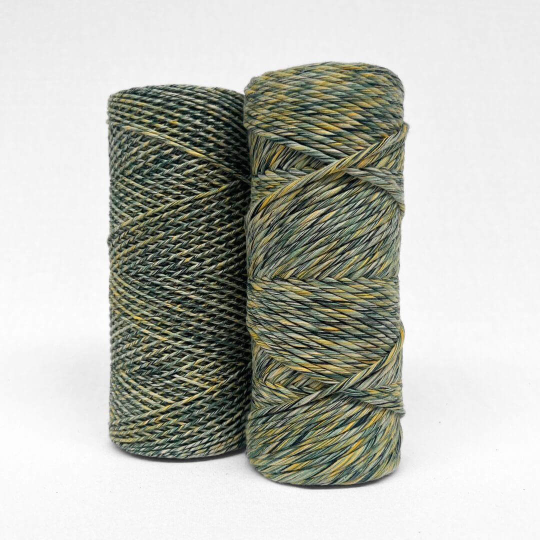 two rolls of mixed macrame string green and yellow showing 1.5mm and 4mm variation on white background