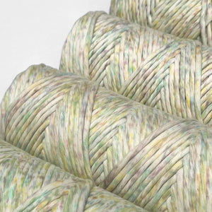 close up  of image of four rolls of fruit tingle confetti macrame string showing unique colour way and watercolour effect