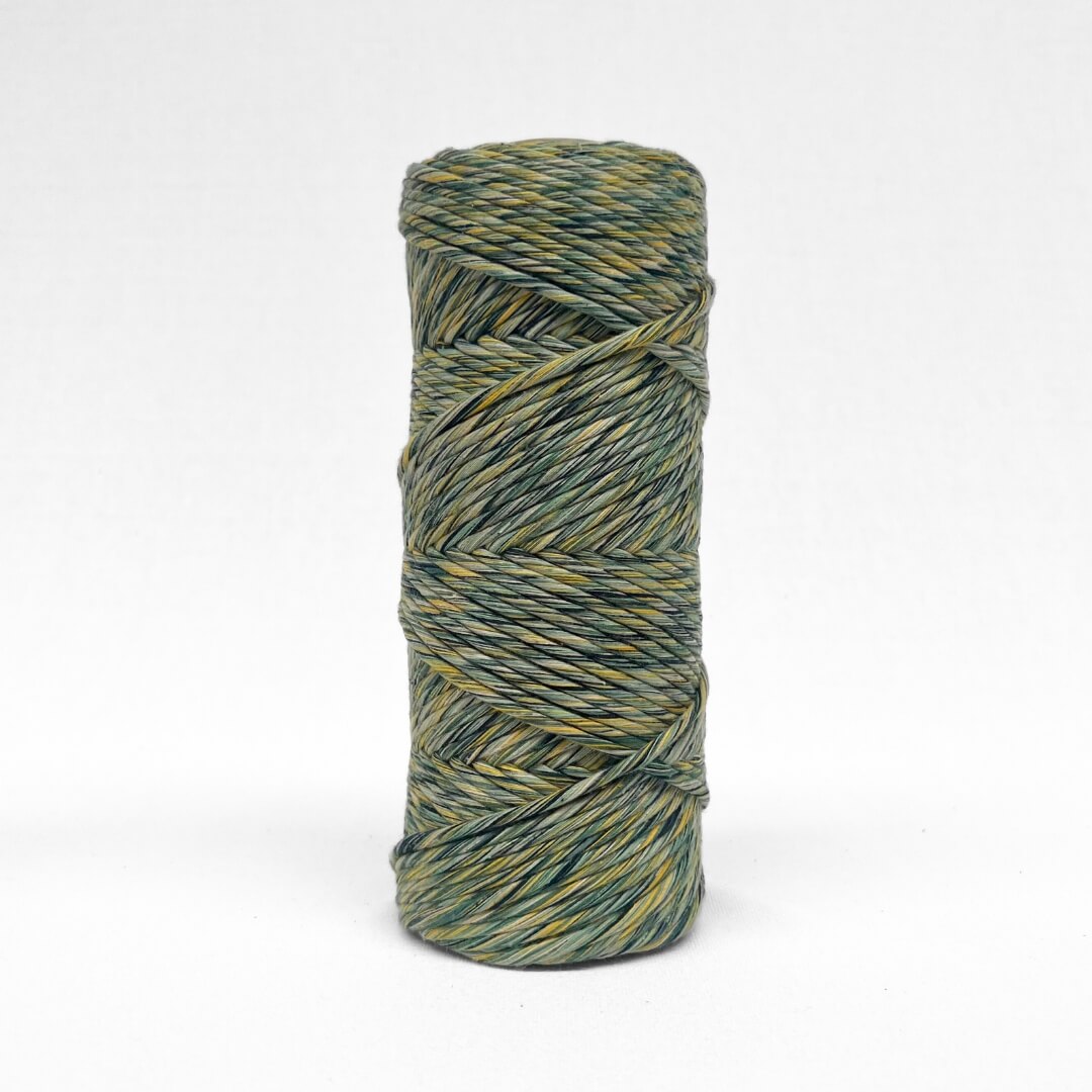 one roll of mixed macrame cord in 4mm green and yellow on white background