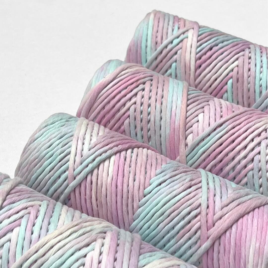 four rolls of unicorn hand painted macrame cord in clode up image highlighting the unique colour combination on white background 