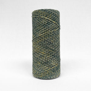 one roll of 1.5mm mixed macrame or and green and yellow colour-way standing upright on white background
