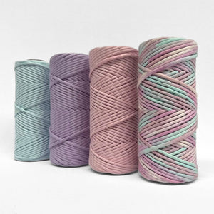 four rolls of macramr cord showing unicorn and its complementing colours on white background 