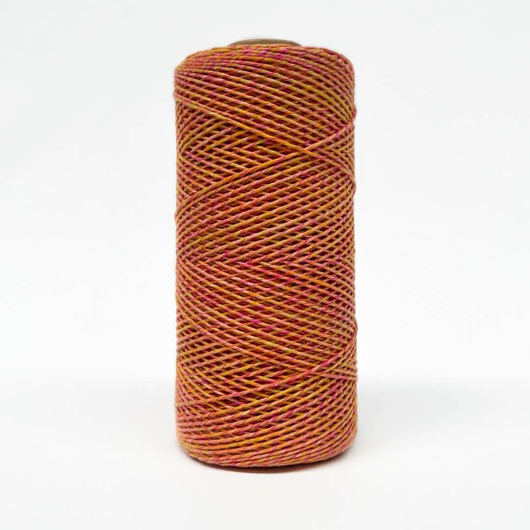 single roll of 1.5mm mixed recycled macrame string 
standing up on white background