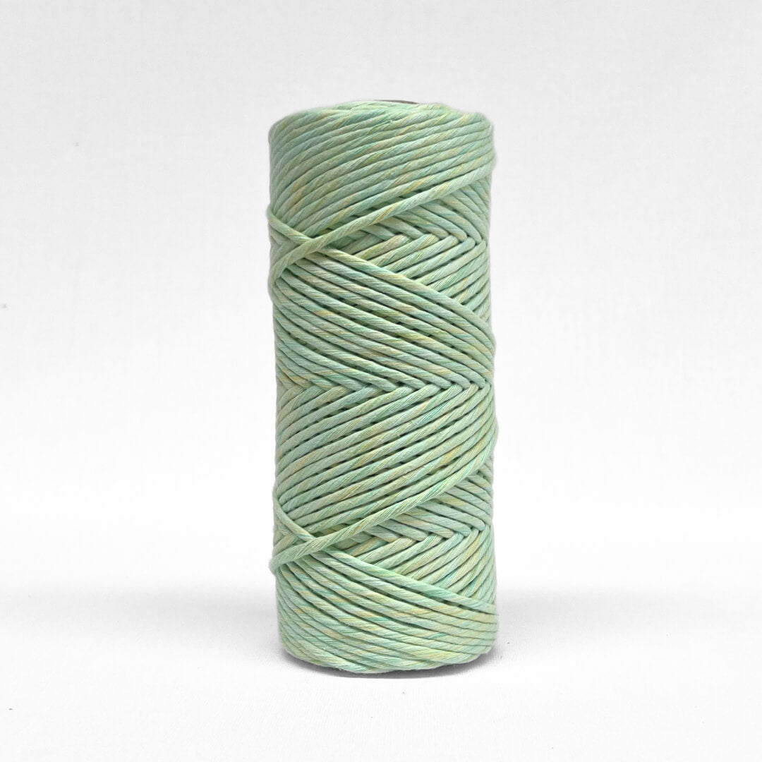 Single rolls of lime splice in 4mm variant on white wall
