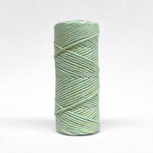 Single rolls of lime splice in 4mm variant on white wall
