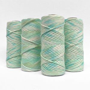 four rolls of ocean spray hand painted cotton cord on white background
