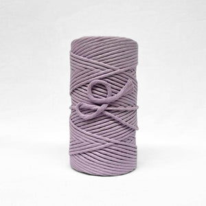 5mm cotton string roll in orchid purple on white background showing up close softness and texture