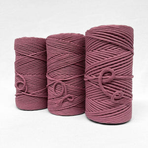 plum pink cotton cord close up image showcasing the rolls in different variations on white background