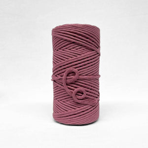 5mm plum pink deep pink cotton roll on white back ground showing up close texture