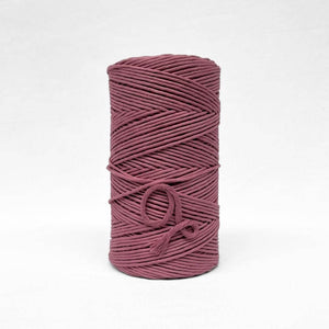 3mm plum pink cotton roll standing alone on white wall