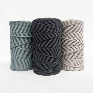 icy blue dark charcoal grey linen neutral cotton string colours in group photo on white back drop