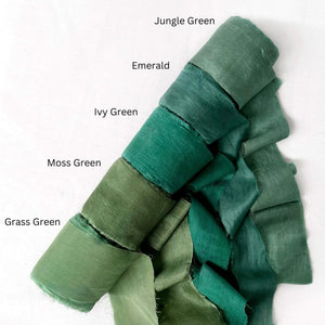 deep green tones jungle emerald ivy green moss grass silk roll group photo showing up close texture on white backdrop