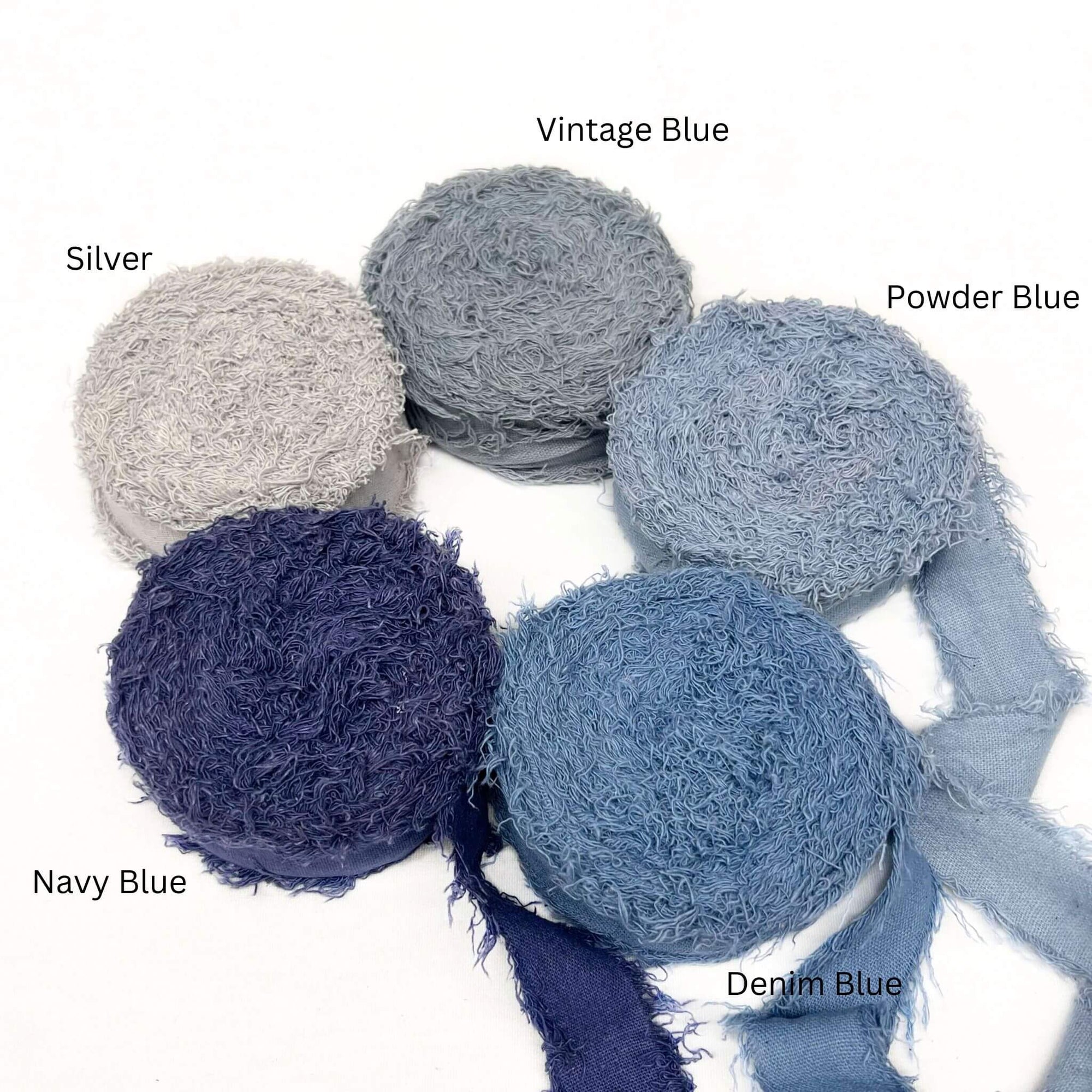 vintage blue powder blue denim blue navy silver grey five rolls of wide frizz ribbon in group photo on white background 