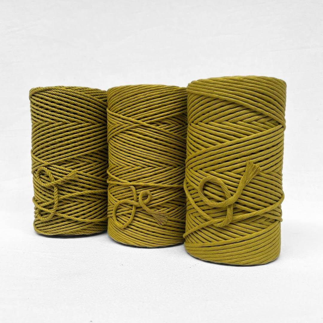three rolls of cotton in chartreuse showing rope and string on white background to show size differences
