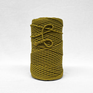 image of single roll of chartreuse yellow cotton rope on white background 