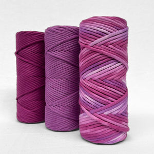 combination photo showing very berry limited edition purple hand painted string standing with its matching purple solid colours on white background 