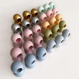 15mm wooden colour craft beads suitable for baby needs lined up in colour gradient