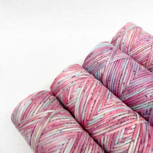 purple blue and pink mixed macrame string on white background