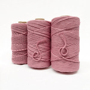 vintage pink combination photo showing string and rope on white wall