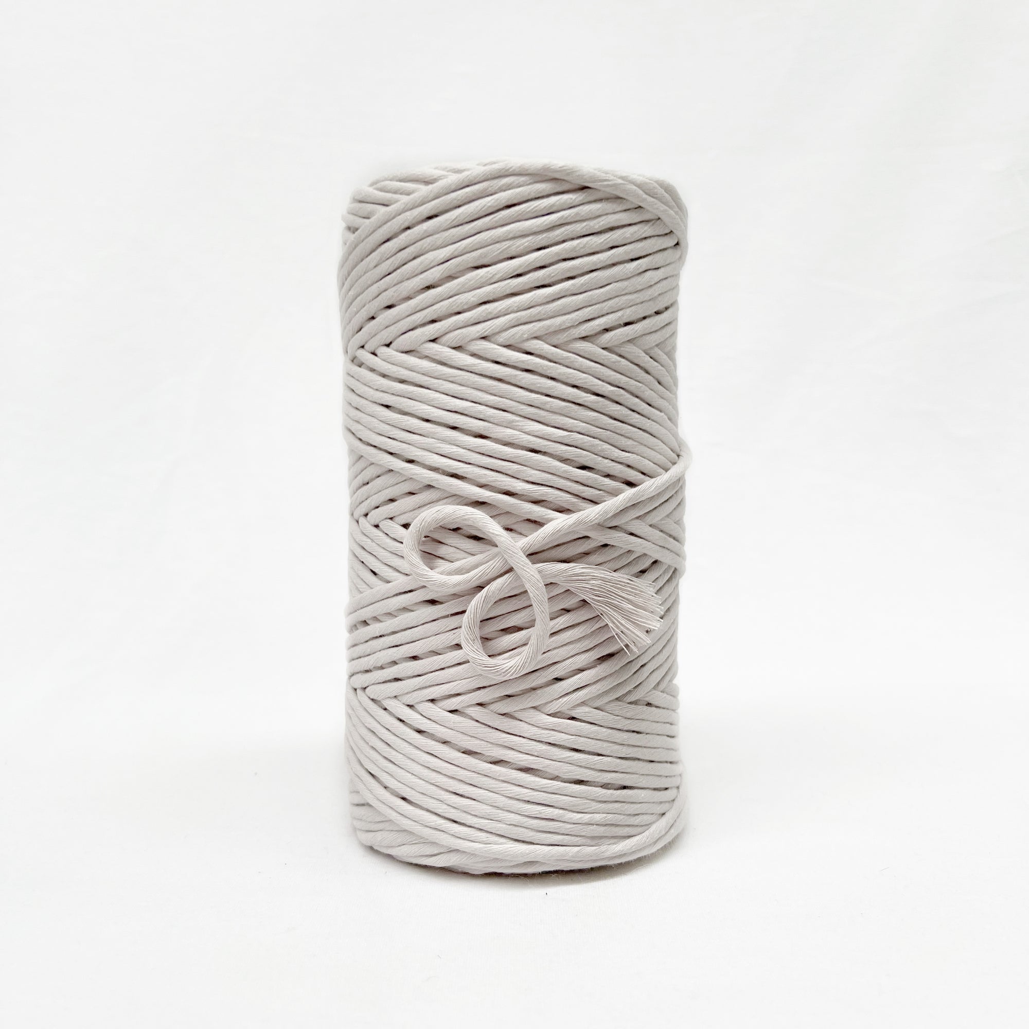 5mm ivory coloured macrame string with soft end brushed out showing individual lengths of fibre