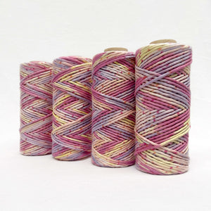 yellow pink and purple macrame cord standing in line on white background showing scale and premium quality