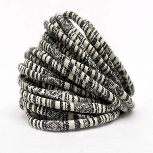 black and white hand loomed woven cord for craft on white background
