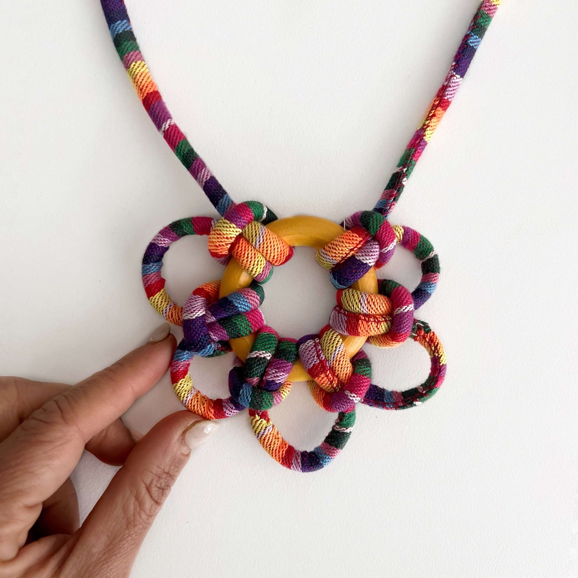woven cord made into fun necklace with macrame pattern