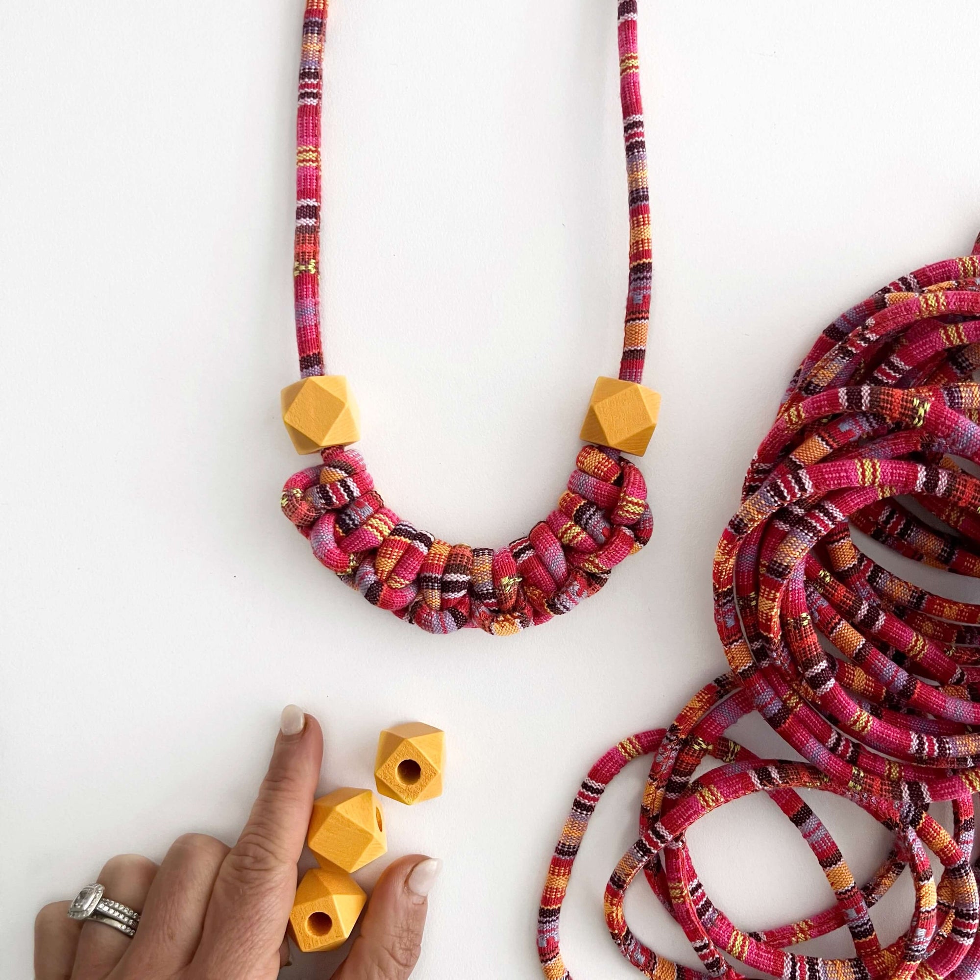 woven cord necklace design with braided rope and beads