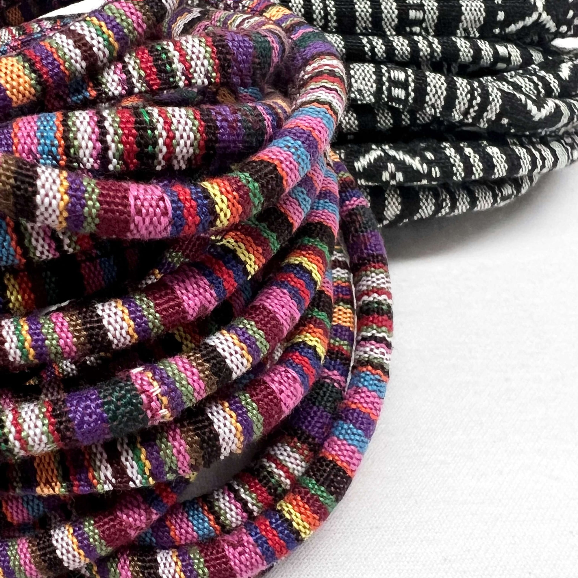 up-close view of hand loomed woven cord showing colour and intricate details of designs